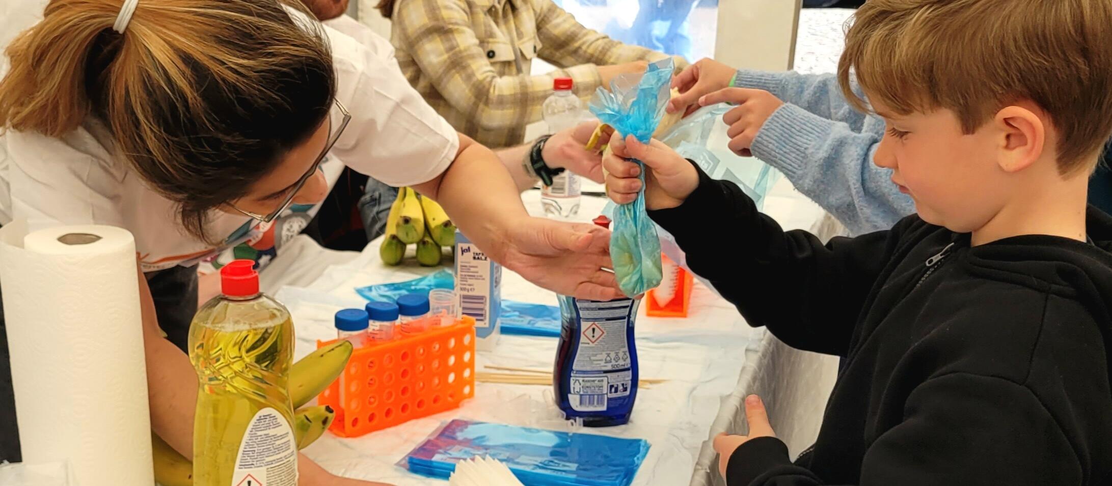 Boy prepping DNA at the Day of Immunology