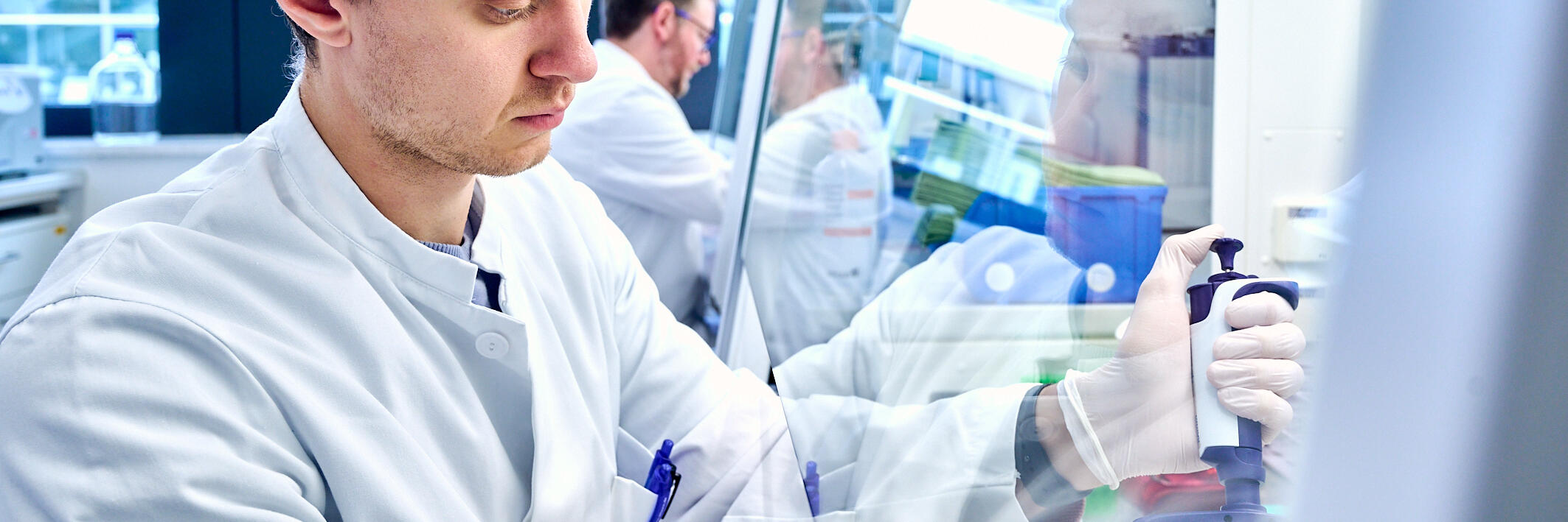 Scientist at sterile bench