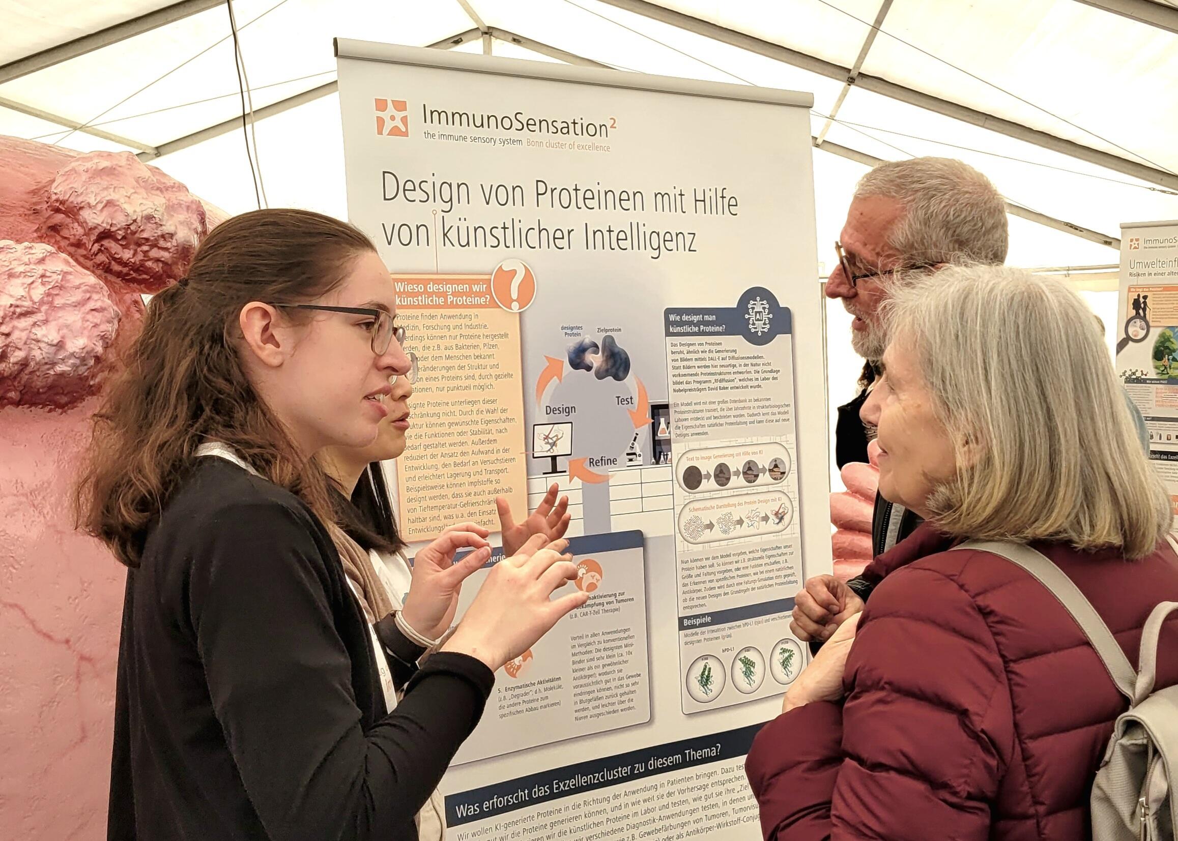 Scientists explain their research to visitors at the "Day of Immunology" event in Bonn